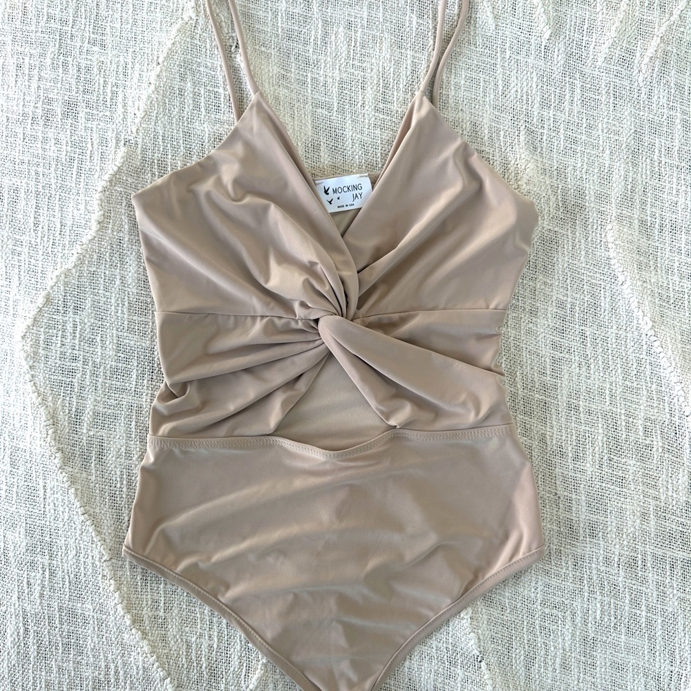 Nude, wrapped cut out body suit. New never worn